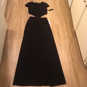 BRAND NEW. Black cut out long dress with slit